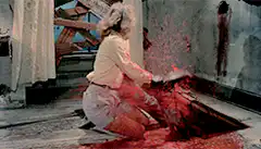 woman pulled into red liquid