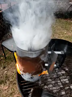 Charcoal chimney starter smoking