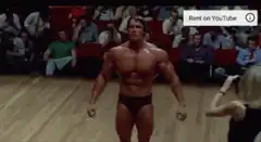 Arnold Schwarzenegger posing on stage