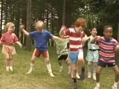 kids dancing in the woods
