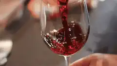 red wine being poured into a glass