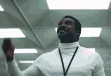 Idris Elba looking up and smiling