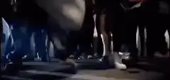 People diving over a white shoe