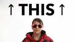 Woman pointing up at THIS text