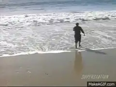 Man running into ocean waves