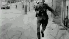 German soldier running and falling
