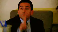 Michael Scott shushing and shrugging