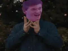 man with purple head making hand gesture