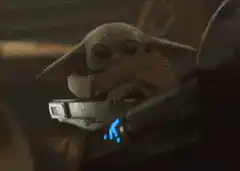 Baby Yoda hides behind helmet