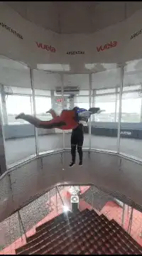 Person flying in a vertical wind tunnel