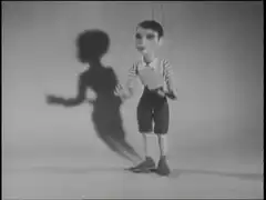 Puppet cuts off its own shadow
