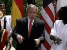 George W. Bush dancing with African drummers