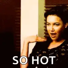 Woman fanning herself saying so hot