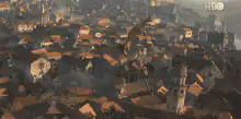 Dragon flies over city