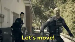 Two police officers running with Let's move