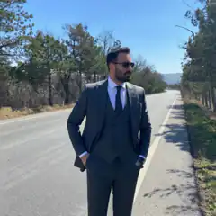 Man in suit on road