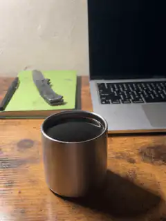 Coffee cup on desk with laptop