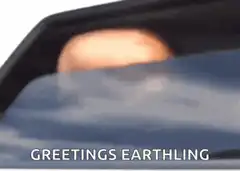 Alien rises from car window