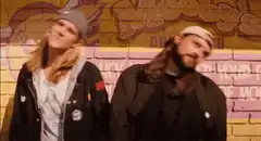 Two guys nodding heads to music