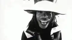 Black and white man in hat laughing