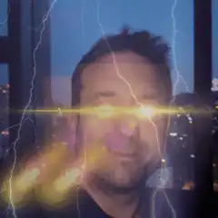 Man with glowing eyes and lightning