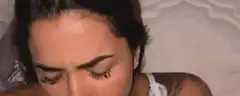 Woman rubbing her eyes