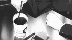 Hand stirring coffee in cup