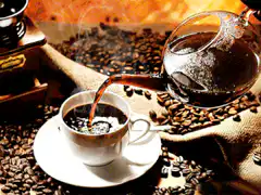 Coffee being poured into a cup