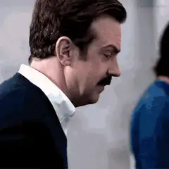 Ted Lasso turns and smiles
