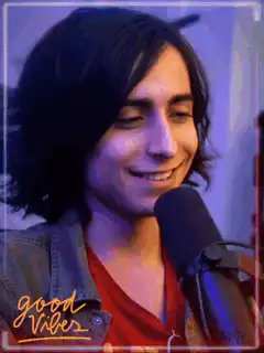 Aidan Gallagher smiling and laughing