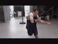 Man in garage doing martial arts moves