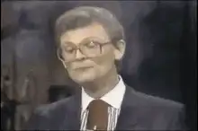 Man in glasses yawning and smiling