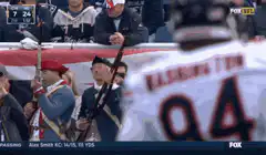 Revolutionary War reenactors fire muskets