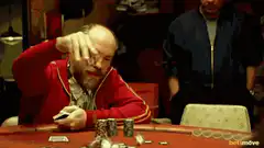 Poker player throws chips and wipes face