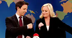 Seth Meyers and Amy Poehler fist bump