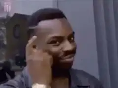 Man tapping head and smiling
