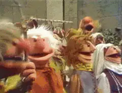 Muppets crowd cheering and waving