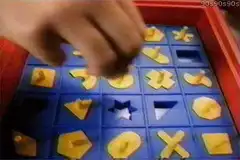 Boy plays shape sorter game