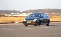 black car jumps over another car
