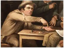 Man pointing at coin on table