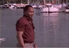 Martin Lawrence smiling by the marina