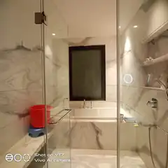 Modern marble bathroom with glass shower