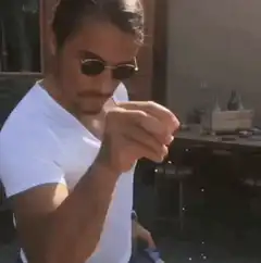 Man shaking glitter off hand