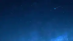 shooting star in night sky