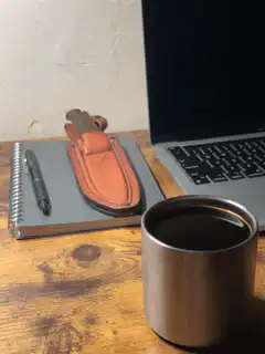 steaming coffee cup on desk