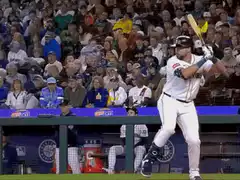Baseball player swings and misses