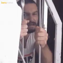 Man shaking bars with a spoon