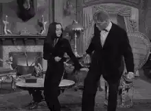 Morticia and Gomez Addams dancing