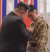 Kim Jong Un hugs soldier