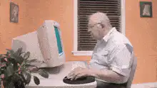 Old man clicks My Computer